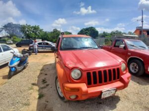 ROJA JEEP LIBERTY ASEGURADA (1)